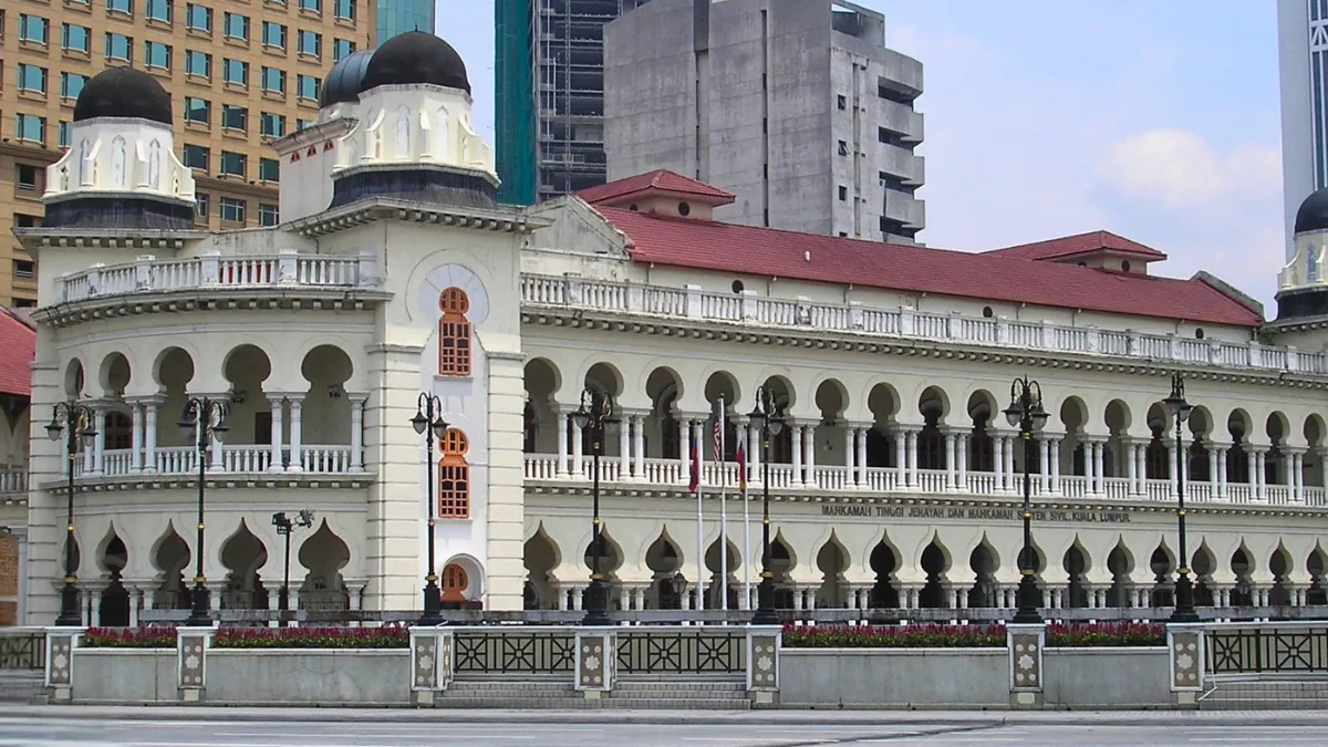 Mahkamah Tinggi Lama (Old High Court) Historic courthouse building with arched colonnades and domed towers in a city center
